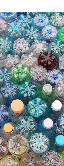 Dirty used colored plastic bottle pile.